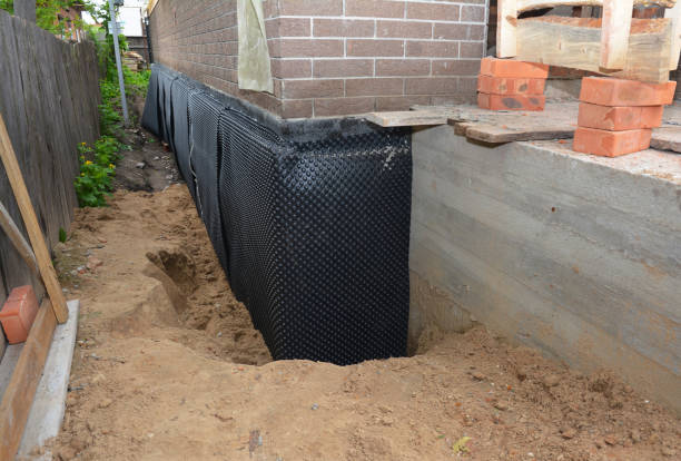 SJ Waterproofing Pros technician performing targeted Exterior Waterproofing assessment in Olivet, MI